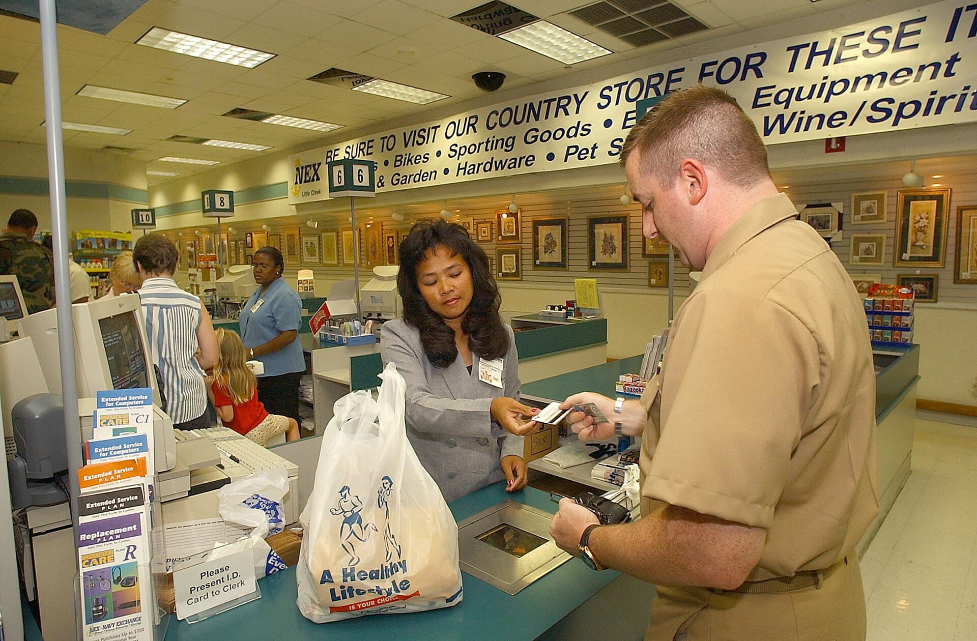 A shopper paying at a cashier counter in a Navy Exchange in Virginia