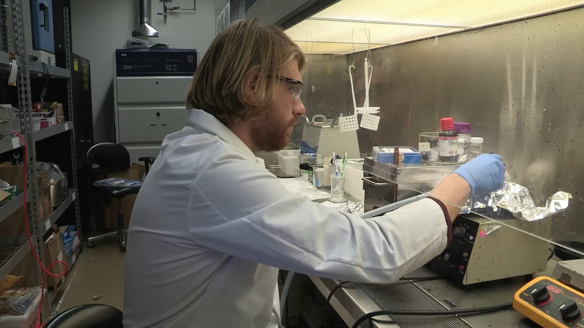 A scientist working at a laboratory bench